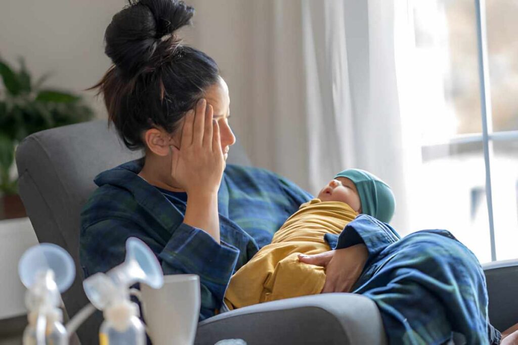 Postpartum and Is Breastfeeding Her Newborn